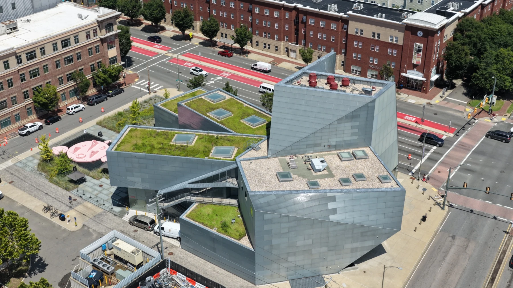 Aerial architectural study of contemporary building with green roofs