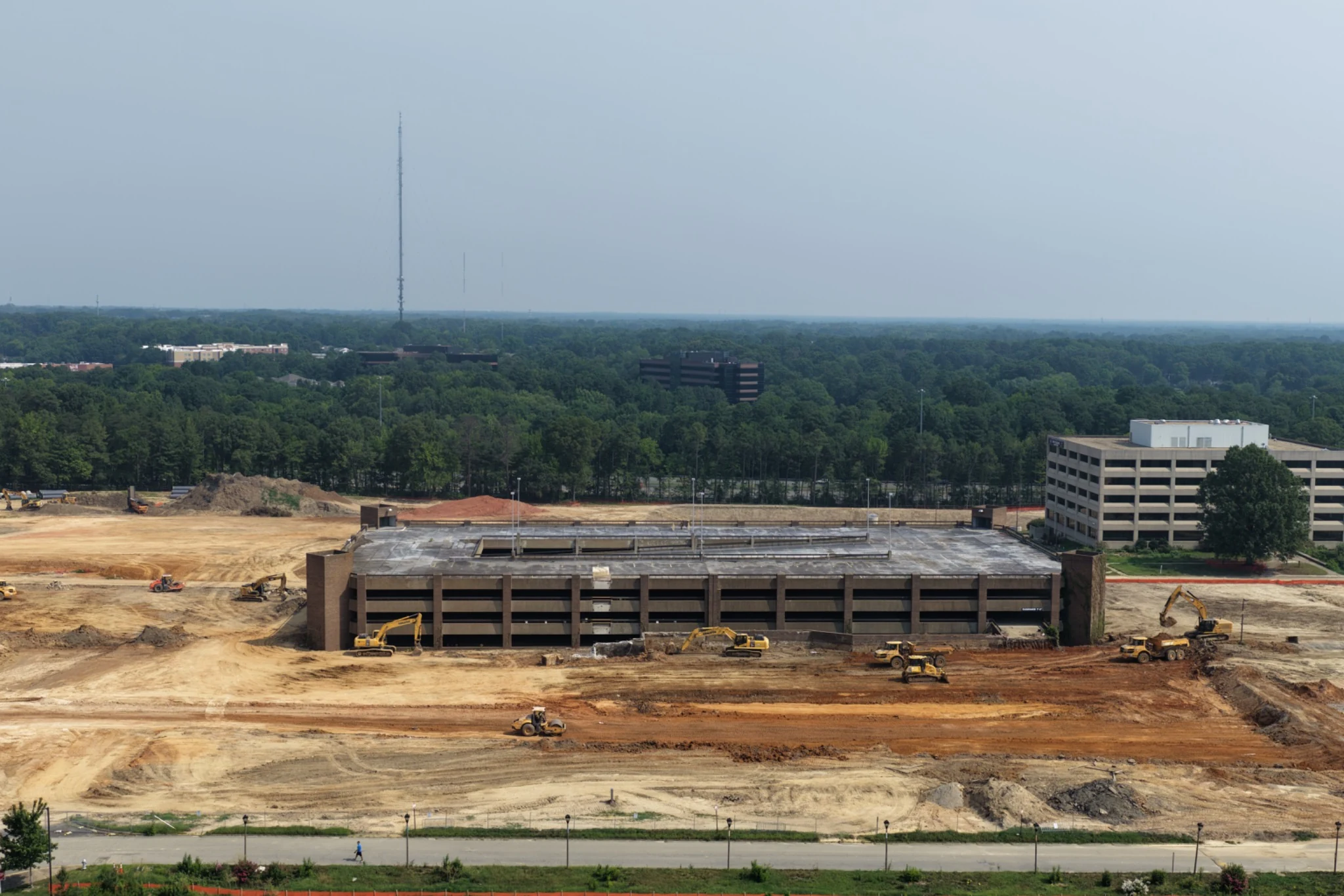 Front aerial view of remaining Midtown parking structure and cleared site