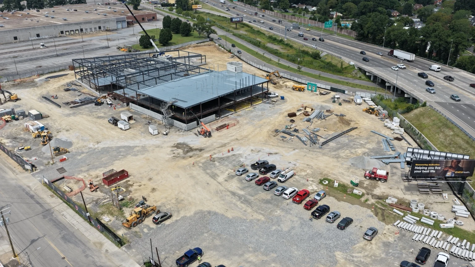 Current VCU Heart Center side perspective with structural progress and material staging.